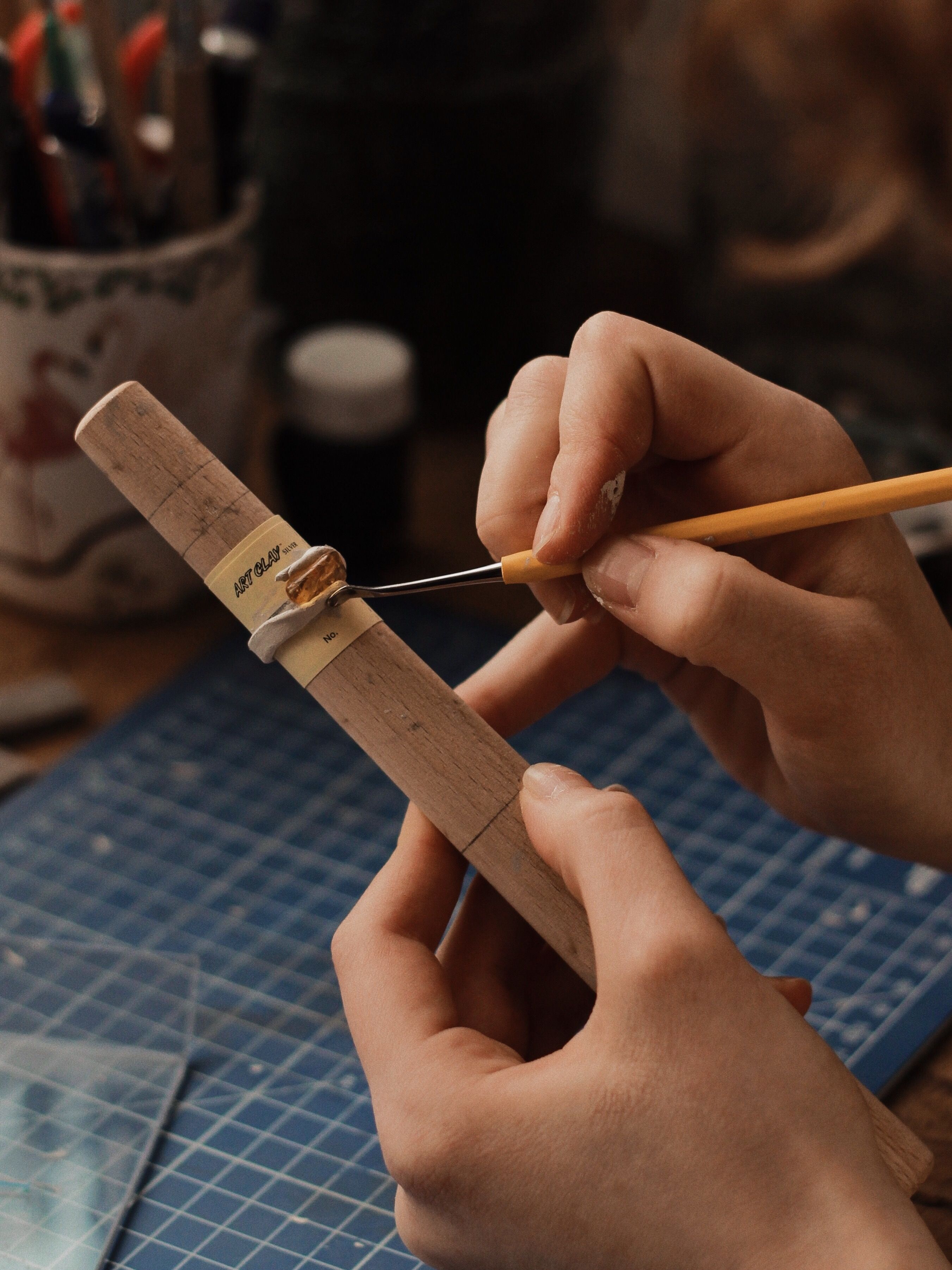 Master goldsmith holding diamond ring